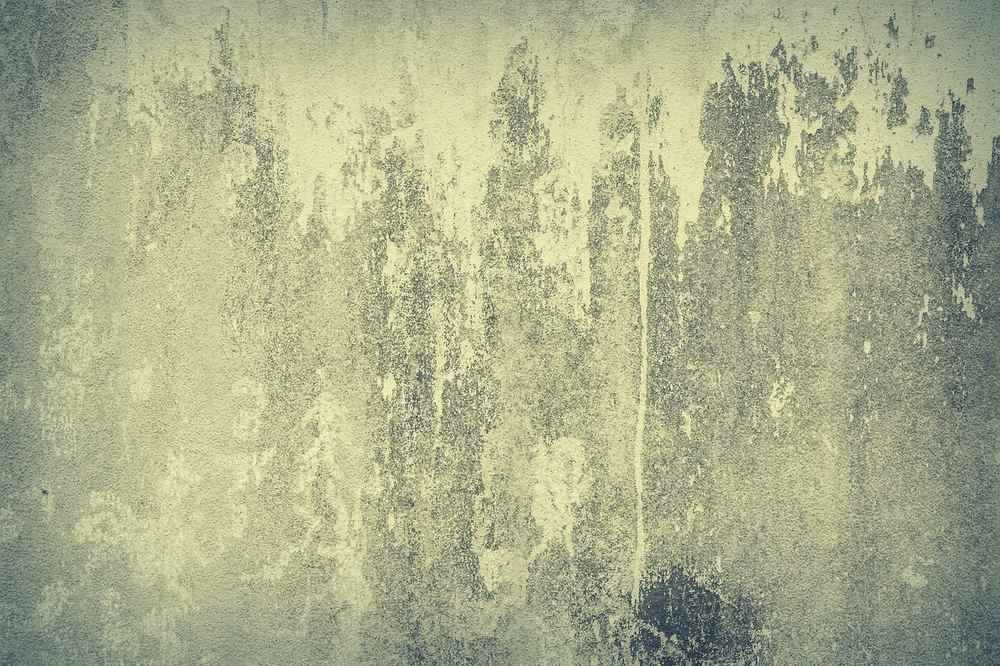Surface dégradée avec taches et fissures